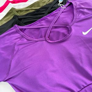 خرید اینترنتی کراپ تاپ ورزشی آستین دار فینگر دار نایکی Nike