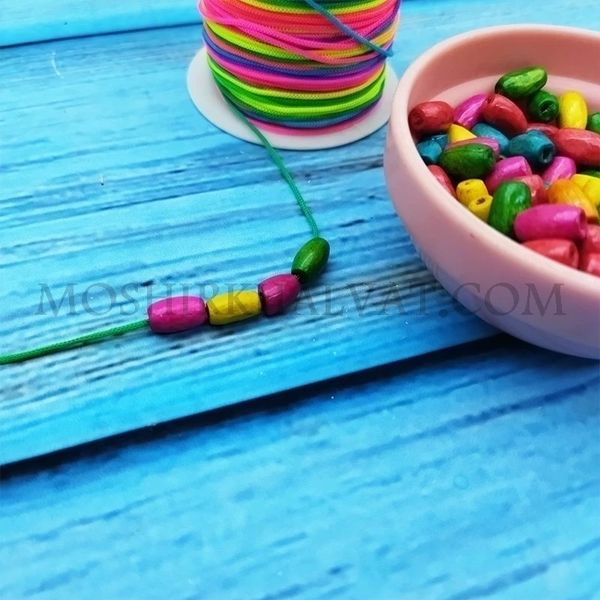 مهره چوبی رنگی مدل گندمی بسته 100 عددی