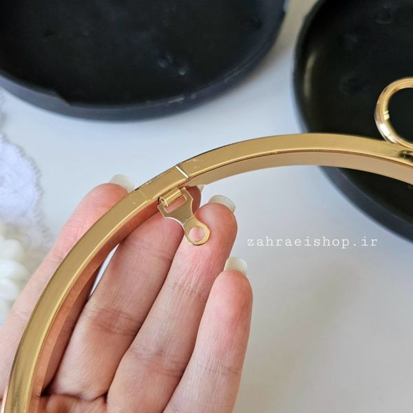 کیف کلاچ مدل دایره دسته دار طلایی