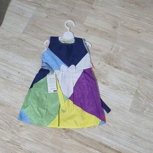 خرید انلاین پیراهن دخترانه پارچه ای رنگارنگ مناسب برای استایل شاد و کودکانه