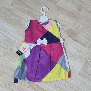 فروش اینترنتی پیراهن دخترانه پارچه ای رنگارنگ مناسب برای استایل شاد و کودکانه