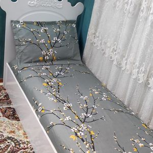 خرید اینترنتی ملحفه تخت کشدار تک نفره طرح شکوفه طوسی تیره