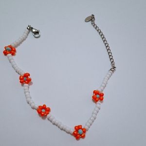 قیمت دستبند یا پابند منجوق طرح گل