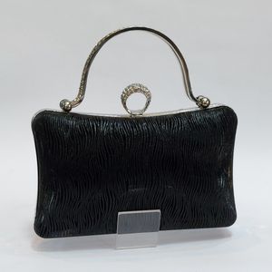 کیف زنانه مجلسی چرم دسته نگین دار