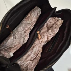 مشخصات کیف زنانه تمام جرم طبیعی گاوی