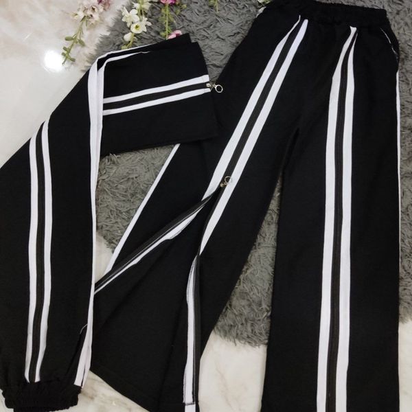 شلوار زنانه طرح ساتین جلو زیپ نوار دار