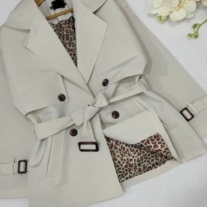 خرید اینترنتی مانتو بارونی آستردار مانیا