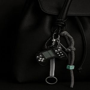 قیمت اویز کیف و کلید زنانه مدل دسته گیم از جنس پلاستیک فشرده و چرم