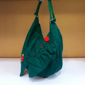 خرید آنلاین کیف اسپرت دکمه‌ای سبز