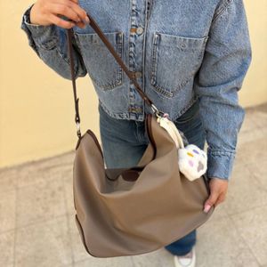 فروش اینترنتی کیف دوشی زنانه و دخترانه جادار مدل آرکانان