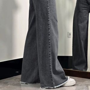 خرید اینترنتی شلوار بگ جین  لی کج راه سنگ شور شده