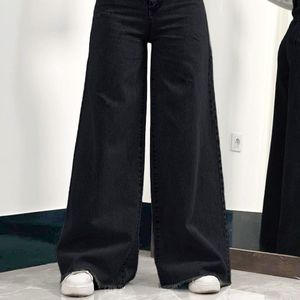 مشخصات شلوار بگ جین  لی کج راه سنگ شور شده