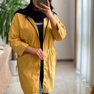 خرید اینترنتی مانتو کلاه‌دار جلو زیپ