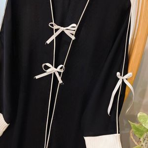 قیمت : مانتو عبایی پاپیون سفید