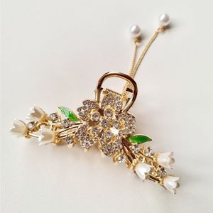 خرید اینترنتی قیمت کلیپس مجلسی فلزی گل و برگ سبز