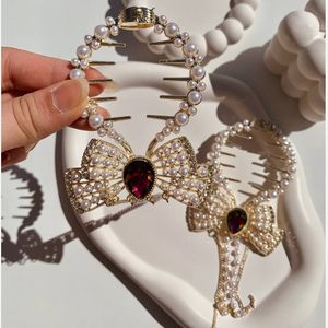 فروش اینترنتی گیره گوجه ای مجلسی پاپیون مرواریدی