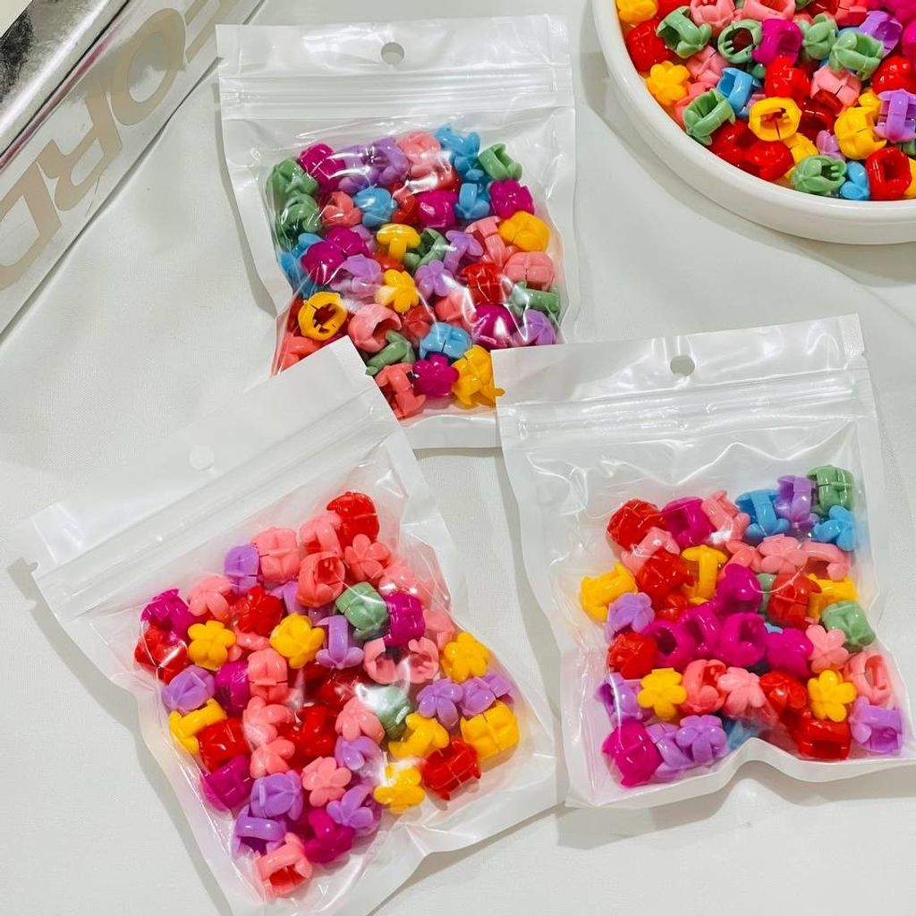 خرید انلاین مهره مو طرح گل محصول وارداتی (بسته 50 عددی)