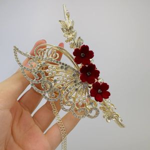 خرید اینترنتی قیمت کلیپس مجلسی فلزی رز قرمز آویزدار