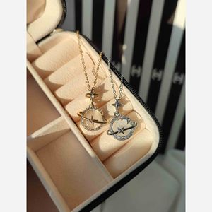 خرید اینترنتی گردنبند زحل زنانه