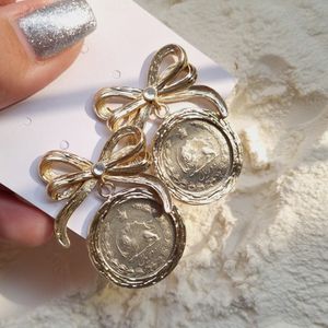 خرید اینترنتی قیمت گوشواره سکه کهنه کاری شده 