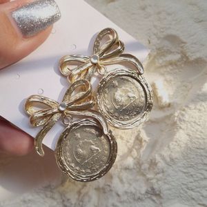 خرید اینترنتی قیمت گوشواره سکه کهنه کاری شده