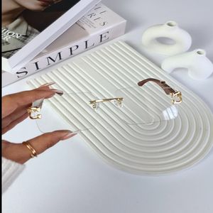 خرید انلاین عینک بلوکات کارتیر دسته چوبی طرح مربعی شفاف