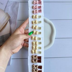 خرید آنلاین گیره انبری دخترانه طرح پاپیونی خارجی کودک و نوزاد رنگ کرم