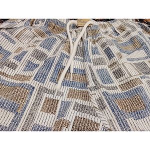 خرید اینترنتی شلوارک مردانه کتان کنفی راحتی دو جیب با کمر بنددار طرح 2