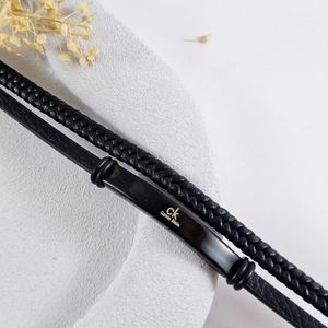 قیمت دستبند چرمی مردانه دولاین با پلاک استیل دو طرح CK و LV | دلسامه