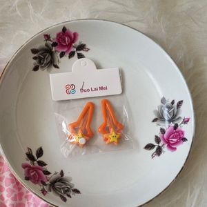 مشخصات پک 2 عددی گیره مو تق تقی پیکسلی خارجی رنگ نارنجی