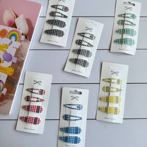 خرید گیره مو تق تقی چهارخانه پک 4 عددی با رنگ‌بندی متنوع