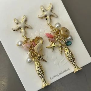 خرید اینترنتی گوشواره ساحلی صدف و ماهی