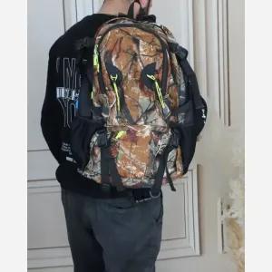 خرید اینترنتی قیمت کوله پشتی مسافرتی و ورزشی پارچه ای چهار جیب بیرونی