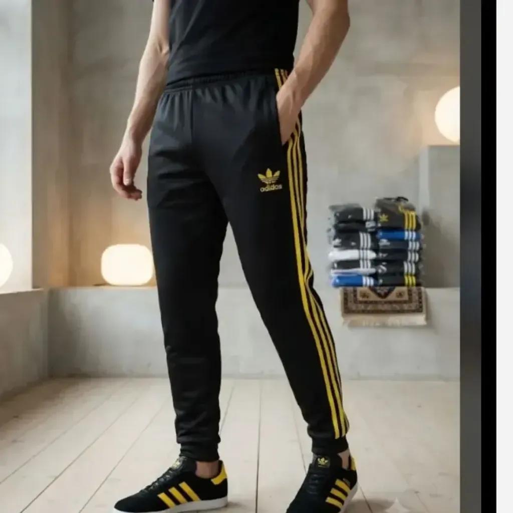 خرید اینترنتی قیمت شلوار اسلش مردانه مدل آدیداس سه خط زرد رنگ مشکی جنس پارچه زهره درجه یک دمپا کش