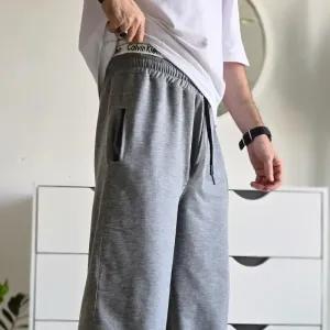 خرید اینترنتی قیمت جاگر کلوین کلین اسلش ملانژ دمپا گت دار مناسب آقا و خانم سایز XXL و XXXL طوسی مشکی برفی