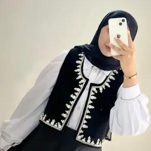 جلیقه جواهر دوزی زنانه مشکی کرپ کنزو قد 122 مناسب مهمانی سایز 38 تا 44