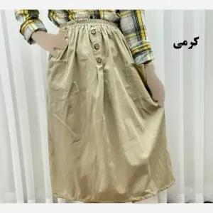 خرید اینترنتی قیمت دامن لنین جلو جیب فری سایز مناسب تا سایز 48