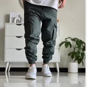 خرید اینترنتی قیمت شلوار شش جیب مردانه پارچه نیل سایز 50 تا 60 رنگ طوسی مشکی سبز