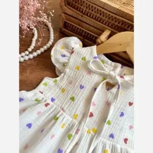 خرید اینترنتی قیمت پیراهن دخترانه طرح قلب جنس موسلین وارداتی مناسب 2 تا 8 سال