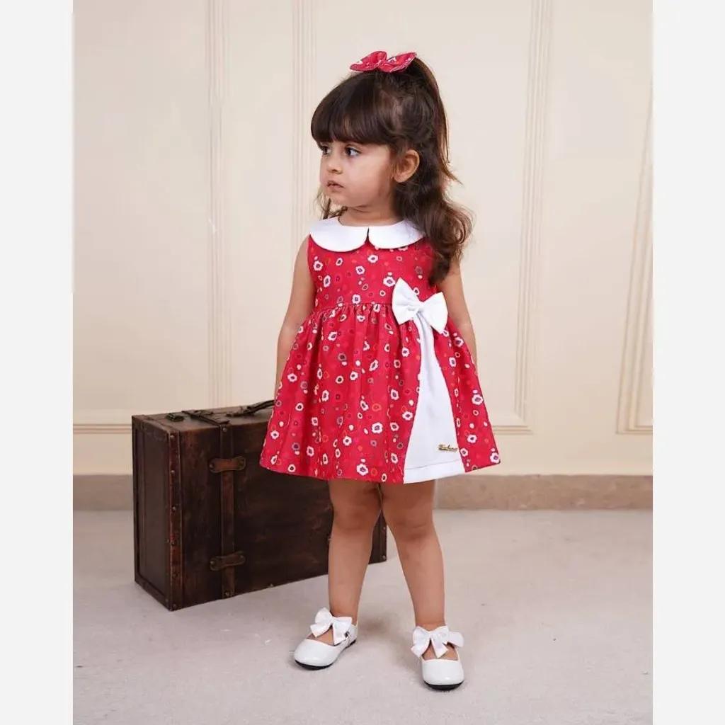 خرید اینترنتی قیمت سارافون نوزادی دخترانه کبریتی کوتاه چیندار با گیره مو رنگ قرمز و صورتی