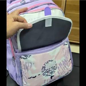 خرید اینترنتی قیمت کوله پشتی مدرسه دخترانه ضد آب پارچه ریپس وارداتی مناسب کلاس اول تا چهارم