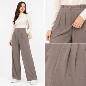 خرید اینترنتی قیمت شلوار زنانه فول بگ کرپ ریزشی طرح miu miu